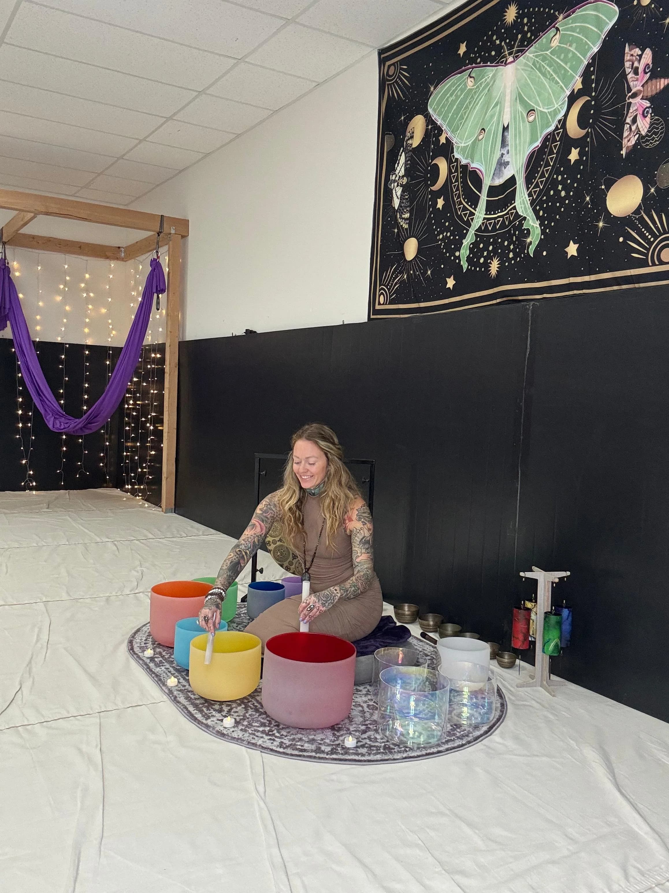 Amanda playing crystal bowls in the sanctuary