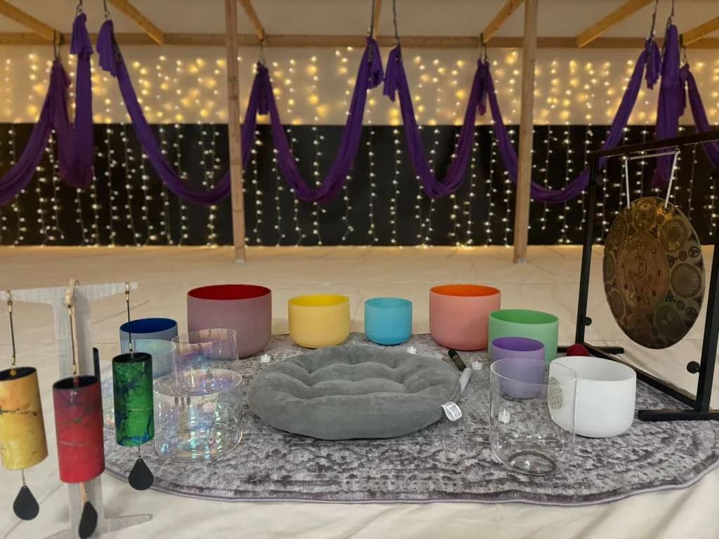 Crystal sound bowls with purple hammocks and fairy lights
